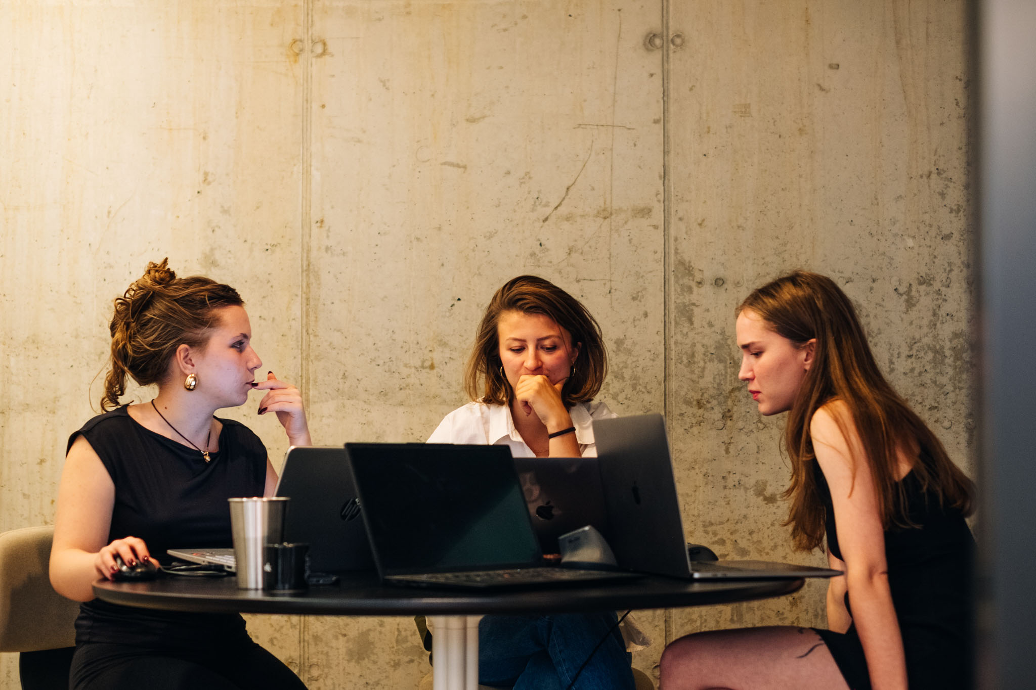 Leona, Mariia and Elizaveta working in the office